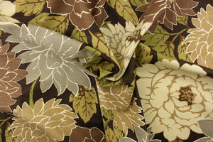  This fabric features a large floral print design in shades of brown, gray, green and cream. 