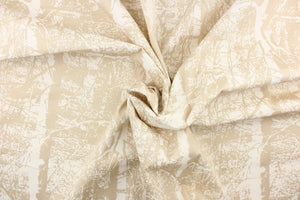 This fabric features an abstract design in beige on a white background. 