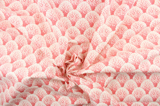 This fabric features white coral set against a flamingo pink background.  