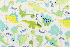 This cute playful print features dinosaurs in green, blue, yellow and brown on a white background.