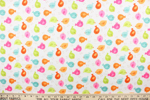  This cute playful print features birds in orange, hot pink, lime green and blue on a white background. 