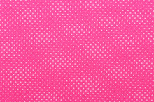 Load image into Gallery viewer, This prints features white polka dots on a pink background. 
