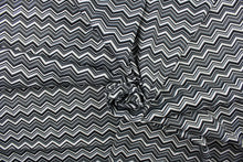Load image into Gallery viewer, This fabric features a black and white chevron pattern. 
