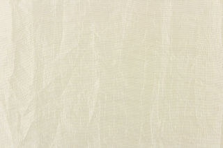 This taffeta fabric features a crinkle design in a rich cream color. 