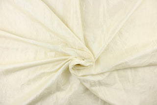 This taffeta fabric features a crinkle design in a rich cream color. 