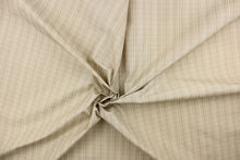 Load image into Gallery viewer, This stunning yarn dyed fabric features a small plaid design in light khaki and beige.
