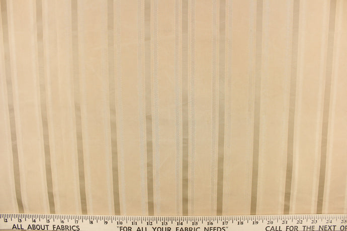  This stunning yarn dyed fabric features a striped pattern in khaki.