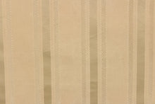 Load image into Gallery viewer,  This stunning yarn dyed fabric features a striped pattern in khaki.
