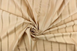 This stunning yarn dyed fabric features a striped pattern in khaki.