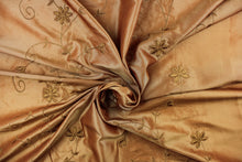 Load image into Gallery viewer, This beautiful fabric features an embroider floral design in a iridescent gold. 
