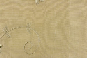  This beautiful jacquard fabric features an embroider floral design in a khaki color. 