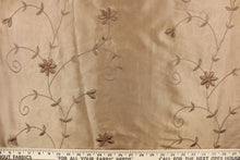 Load image into Gallery viewer,  This beautiful jacquard fabric features an embroider floral design in a golden tan.
