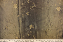 Load image into Gallery viewer,  This beautiful fabric features an embroider floral design in a iridescent dark olive green
