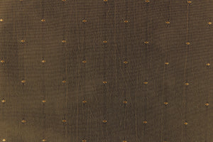 This beautiful jacquard fabric features an embroider pin head design in a dark olive green. 