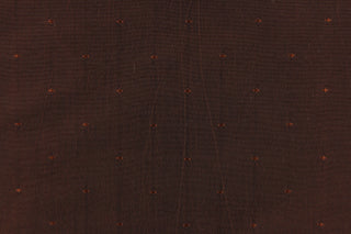 This beautiful jacquard fabric features an embroider pin head design in a rich dark brown. 