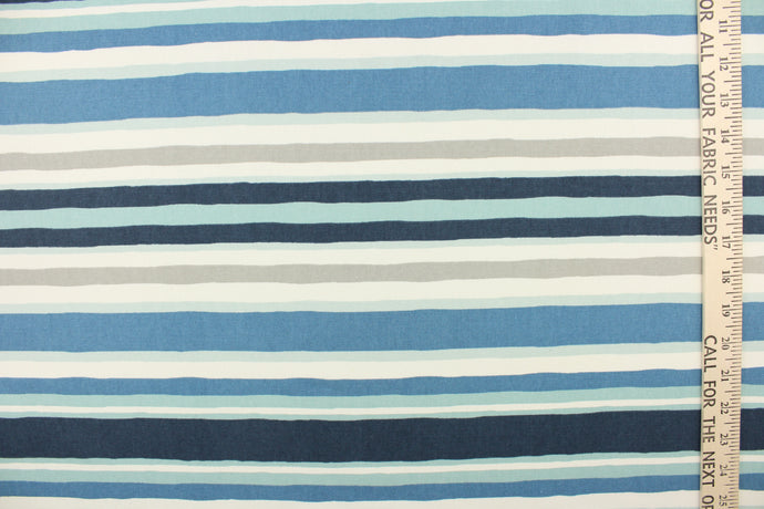 This heavy striped fabric in shades of blue, gray and white would be a great accent to your home decor projects. 