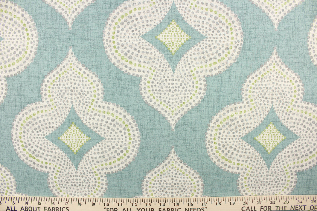  This fabric features a fun geometric print design.  Colors include green, gray, white and turquoise.