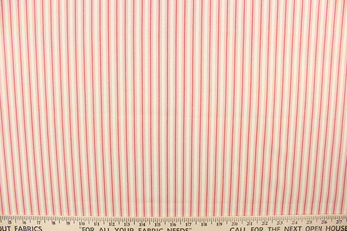  This heavy striped fabric in red and off white would be a wonderful accent to your home decor.