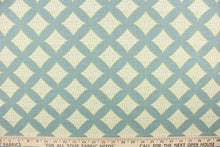 Load image into Gallery viewer, This fabric features diamonds in green and white against a turquoise background.
