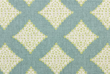 Load image into Gallery viewer, This fabric features diamonds in green and white against a turquoise background.

