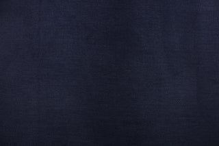 This suede fabric features a weave design in a solid deep blue. 