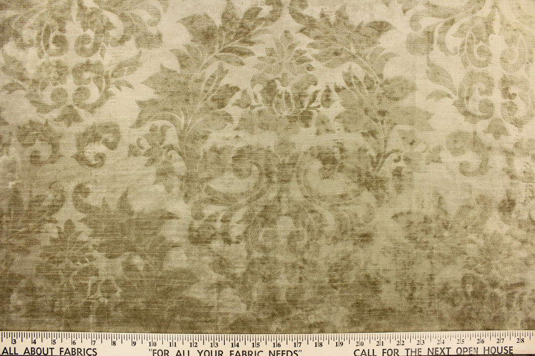 This velvet features a beautiful floral scroll design in  solid beige color. 