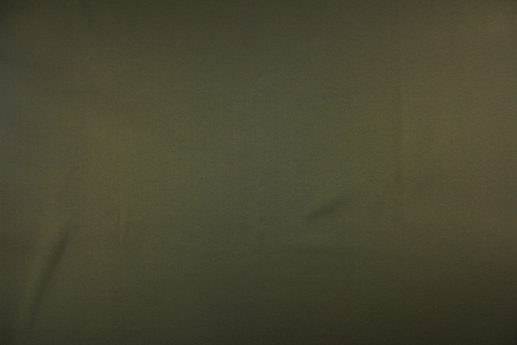This beautiful versatile fabric offers a slight sheen in a solid dark green gray color. 