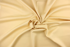 This beautiful versatile fabric offers a slight sheen in a solid pale tan.