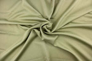 This beautiful versatile fabric offers a slight sheen in a solid green. 