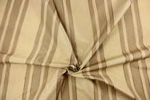 Load image into Gallery viewer,  This fabric features a multi width stripe design in beige tones, tan and gold.
