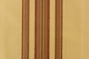  This fabric features a multi width stripe design in tan and a rich red.