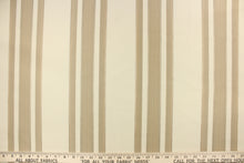 Load image into Gallery viewer, This fabric features a multi width stripe design in off white or light khaki and beige. 
