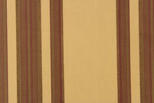 Load image into Gallery viewer,  This fabric features a multi width stripe design in tan, brown and burgundy.
