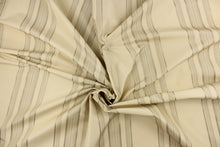 Load image into Gallery viewer, This fabric features a multi width stripe design in khaki, and beige. 
