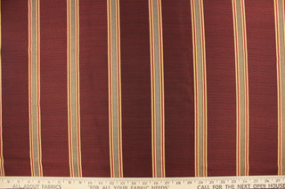 This rich woven yarn dyed fabric features bold multi width striped design in a rich wine red, taupe, and gold. 