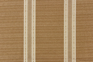 This rich woven yarn dyed fabric features bold multi width striped design in gold, cream, and champagne. 