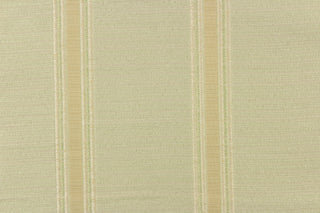 This rich woven yarn dyed fabric features bold multi width striped design in pale green, cream and khaki. 