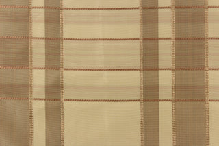 This fabric features a plaid design in beige, taupe, gold, and light mauve .
