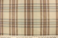 Load image into Gallery viewer, This fabric features a plaid design in mauve, pale blue and taupe. 
