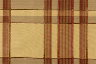 This fabric features a plaid design in tan, red and brown.