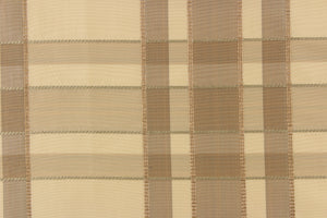 This fabric features a plaid design in khaki, taupe, and light beige .