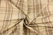 Load image into Gallery viewer, This fabric features a plaid design in khaki, taupe, and light beige .
