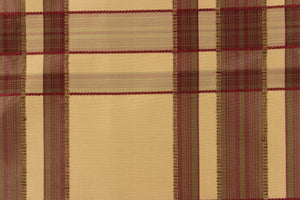 This fabric features a plaid design in deep red, tan, and dark brown.