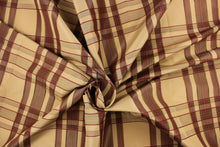 Load image into Gallery viewer, This fabric features a plaid design in deep red, tan, and dark brown.
