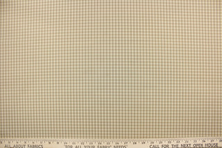 This yarn dye stripe fabric features a small plaid or checkered design in cream, khaki and gray or taupe. 