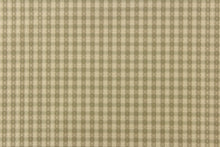 Load image into Gallery viewer,  This yarn dye stripe fabric features a small plaid or checkered design in light khaki and pale green.
