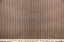 Load image into Gallery viewer, This stunning yarn dyed fabric features a small plaid design in taupe and plum.

