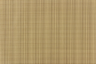  This stunning yarn dyed fabric features a small plaid design in beige and khaki. 