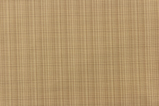  This stunning yarn dyed fabric features a small plaid design in beige tones and tan. 