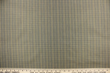 Load image into Gallery viewer,  This stunning yarn dyed fabric features a small plaid design in blue, black, and golden tan or beige.
